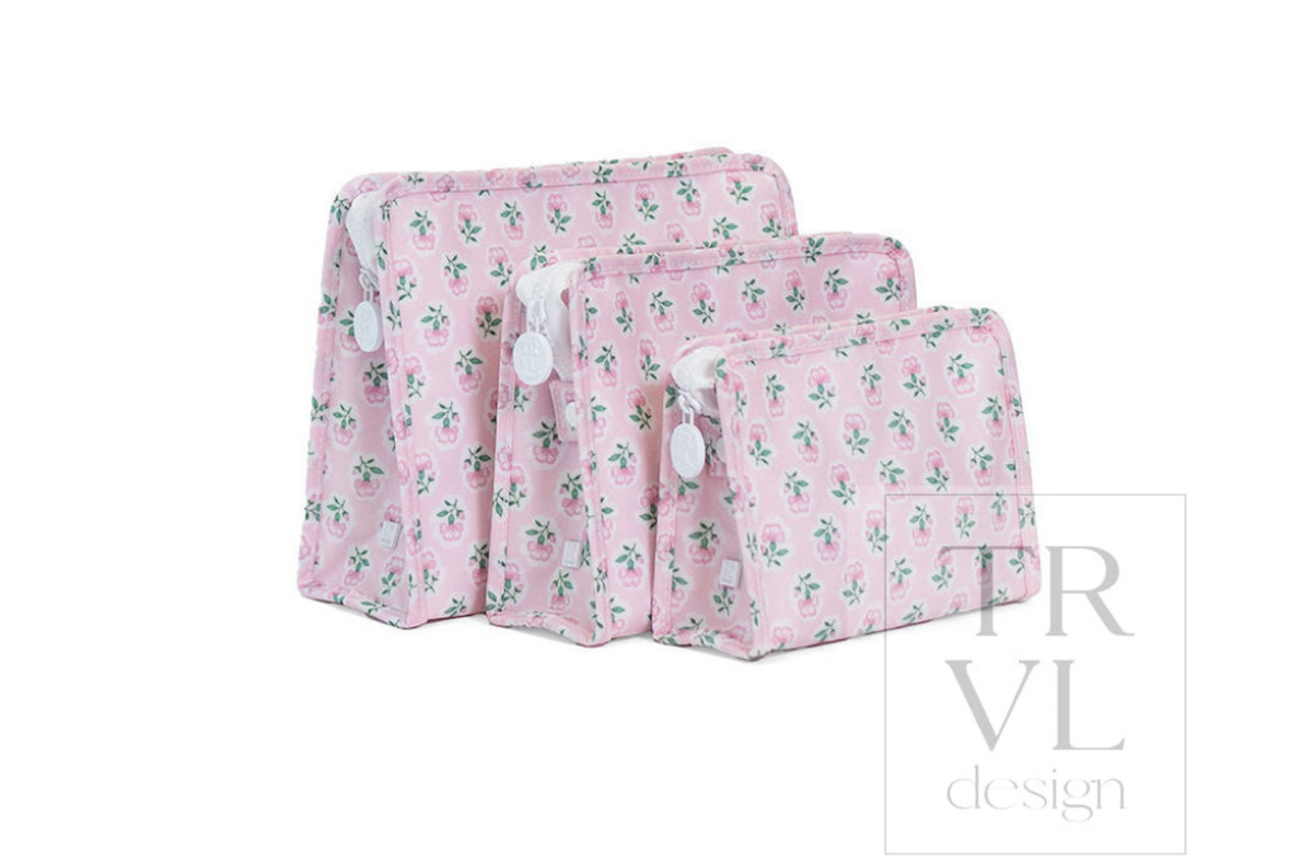 TRVL Large, Medium, and Small Roadies stacked in front of each other in the Petite Fleur Pink Print.